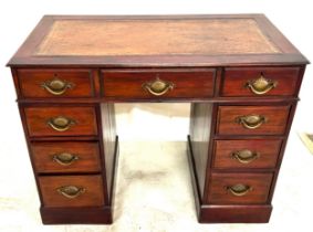 Antique mahogany leather top 9 drawer desk measures approx 27 inches tall by 37.7 inches wide