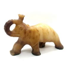 Onyx elephant measures approx 6 inches tall by 8 inches wide