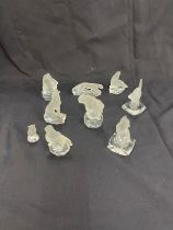 Selection of frosted glass paper weights includes goeble, cats, bear, sea lion etc