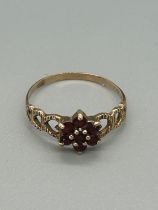 Ladies 9ct gold garnet set dress ring total weight 2grams ring size U