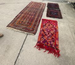 Three vintage rugs largest measures approximately length 104 inches, width 44 inches
