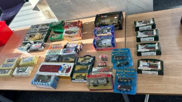 Large selection of boxed die cast cars includes british street scenes etc