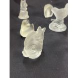 Selection of frosted glass paper weights includes lions, elephants, dogs etc