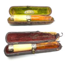 2 cased antique amber & silver collar cheroot holders