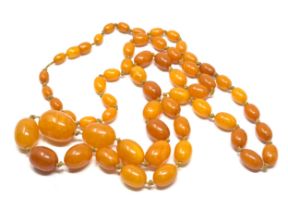 Vintage long egg yolk amber bead necklace measures approx 115 cm long weight approx 52g