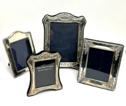4 silver 17cm by 14cm picture frames largest measures approx