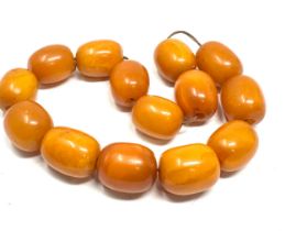 Egg yolk amber beads average size of beads approx 21mm by 16mm weight 50g