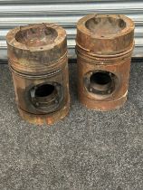 Pair of large engine pistons measures approx 15.5 inches tall by 10 inches wide