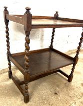 Oak barley twist two tier trolley measures approx 29 inches tall by 24 inches wide and 17 inches