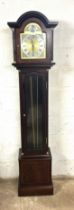 Reproduction mahogany grandfather clock measures approx 77 inches tall
