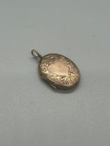 Antique rose gold locket with heart shaped motif to front. Back marked gold. 4.4 grams