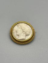 Antique yellow metal cameo brooch