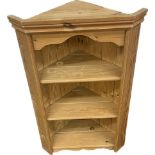 Pine wall hanging corner cabinet measures approx 33 inches tall by 21 inches wide and 13 inches