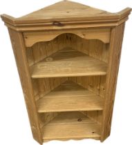 Pine wall hanging corner cabinet measures approx 33 inches tall by 21 inches wide and 13 inches