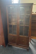 Oak two door glazed bookcase measures approx width 30 inches by 61 inches tall