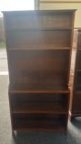 Walnut bookcase measures approx 33 inches wide by 69 inches tall