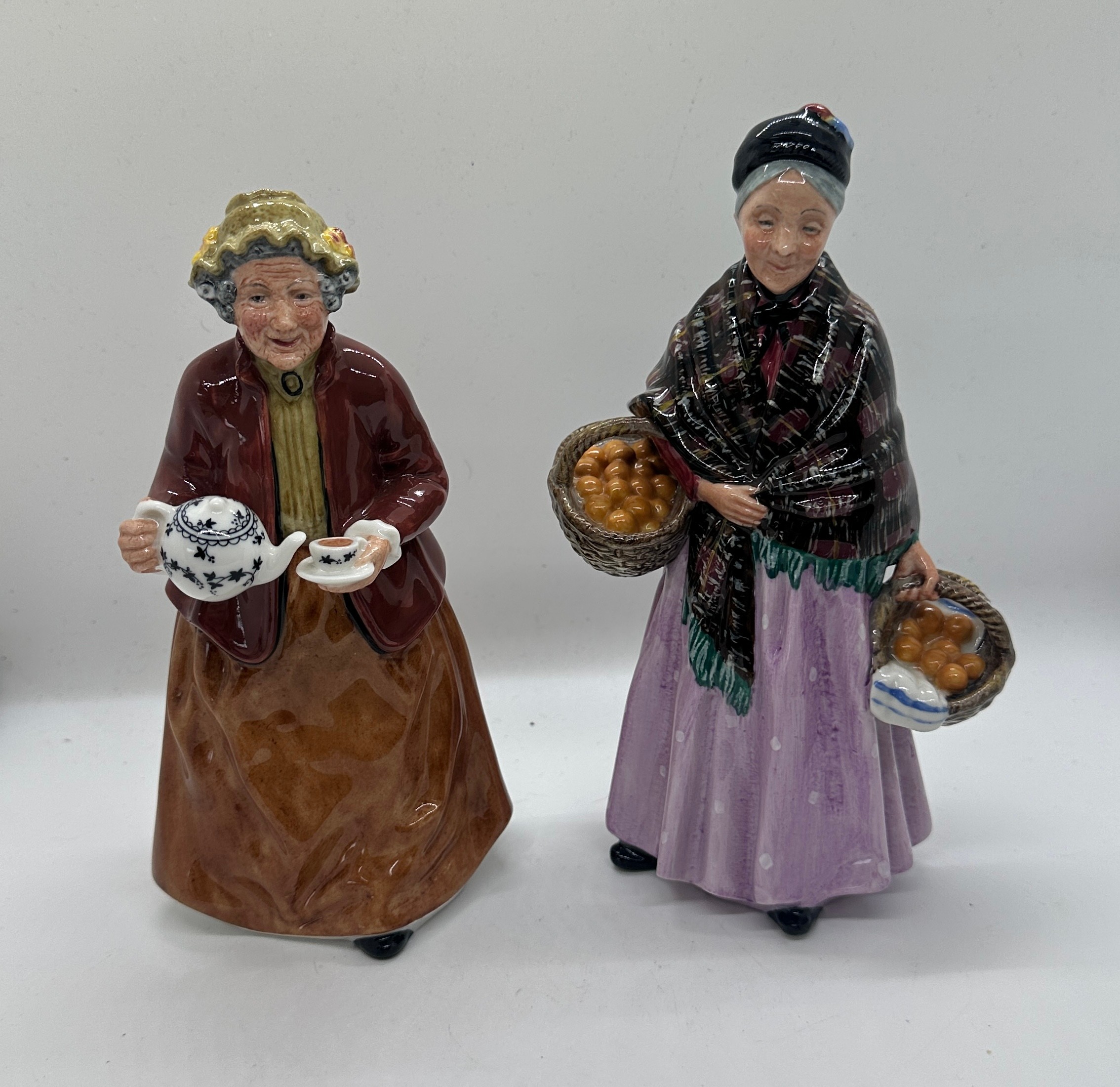 Two vintage Royal Doulton figures ' The Orange Lady' and ' Tea Time' HN2255 tallest measures