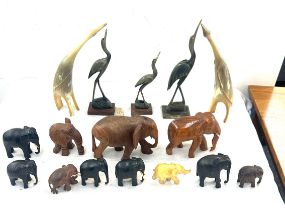 Selection of carved wooden and horn animal ornaments to include elephants, birds etc