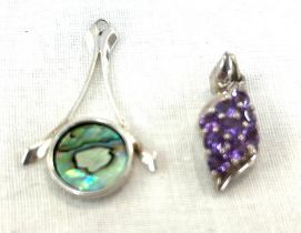 Silver and abalone shell pendant and a stone set pendant