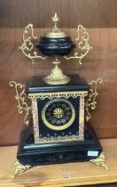 Marble/slate mantel clock with gilding measures approx 21 inches tall by 13.5 inches wide