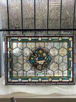 Vintage stained glass window measures approximately 28 inches by 20 inches wide