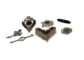 Large selection of silver and marcasite brooches