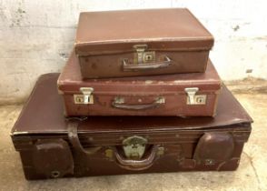 Three vintage suitcases one leather