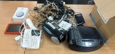 Box of electrical and tech items includes phones, kindle, tape recorder, dvd player etc