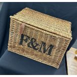 Large wicker basket measures approx 16 inches tall by 23 inches wide
