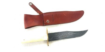 Bear and sons knife in a leather holster