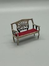 Hallmarked silver miniature bench with cushion