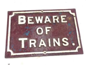 Vintage Cast Beware of Trains sign, approximate measurements: Height 15 inches, Width 22 inches