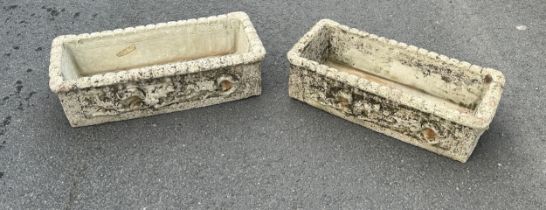 Two concrete planters measures approx 8 inches tall by 27.5 inches wide