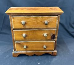 Miniature 3 drawer oak chest measures approximately 12 inches tall 12 inches wide 6 inches depth