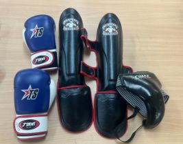 Large selection of kick boxing gloves and knee pads