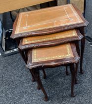 Glass topped mahogany nest of tables measures approx 22 inches tall, 21 inches wide and 15 deep