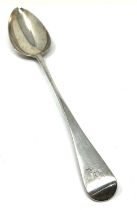 Antique georgian silver basting spoon measures approx 31cm London silver hallmarks weight 130g