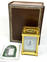 Boxed Matthew Norman brass carriage clock the clock is ticking complete with the key