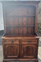 Dark stained Pine 2 door, 2 drawer dresser, approximate measurements: base Height 75 inches, Width