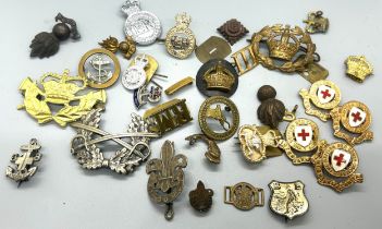 Selection of vintage cap badges, to include military and police pieces