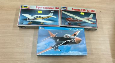 Three Revell air craft model kits to include ' Cessna 150 A150L', 'Piper Cherokee 140', 'F9F-8