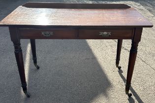 2 drawer mahogany side table, turned legs, brass castors, approximate measurements: Height 31