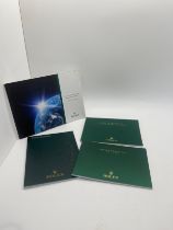 Selection of Rolex watch booklets includes Datejust, Day Date etc