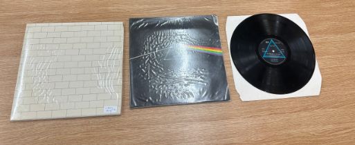 2 Pink Floyd records includes The dark side of the moon and The wall