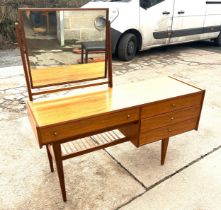 A Younger Limited mid century teak 4 drawer dressing table with mirror 52 inches tall 54 inches wide