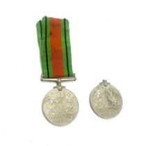 2 WWII Defence medals, one with ribbon