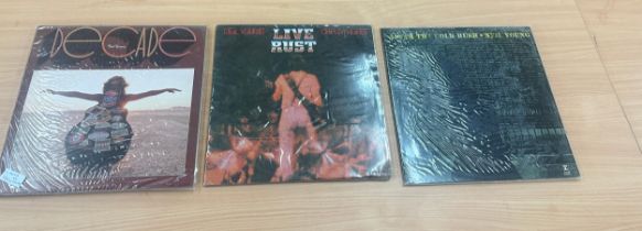 Three Neil Young records includes After the gold rush, Live rust, and decade