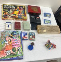 Selection of vintage games, Chinese chequers, nursery rhyme puzzle, Bristol playing cards in leather