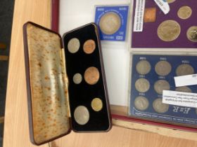 Selection of cased coins includes Queen Elizebeth II Specimen set etc