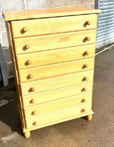Pine 8 drawer chest measures approx 29 inches wide by 18 inches deep and 44 inches tall